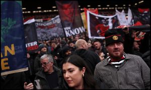 MANCHESTER, ENGLAND - MARCH 15: Fans of Manchester United show their support prior to the Premier League match between Manchester United and Aston Villa at Old Trafford on March 15, 2026 in Manchester, England.