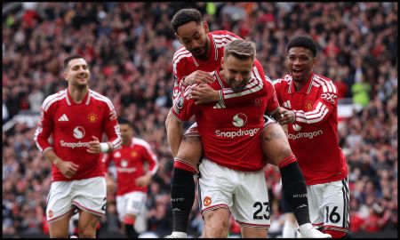 MANCHESTER, ENGLAND - MAY 17: Luke Shaw of Manchester United celebrates scoring his team's first goal with teammates Matheus Cunha and Amad Diallo during the Premier League match between Manchester United and Nottingham Forest at Old Trafford on May 17, 2026 in Manchester, England.