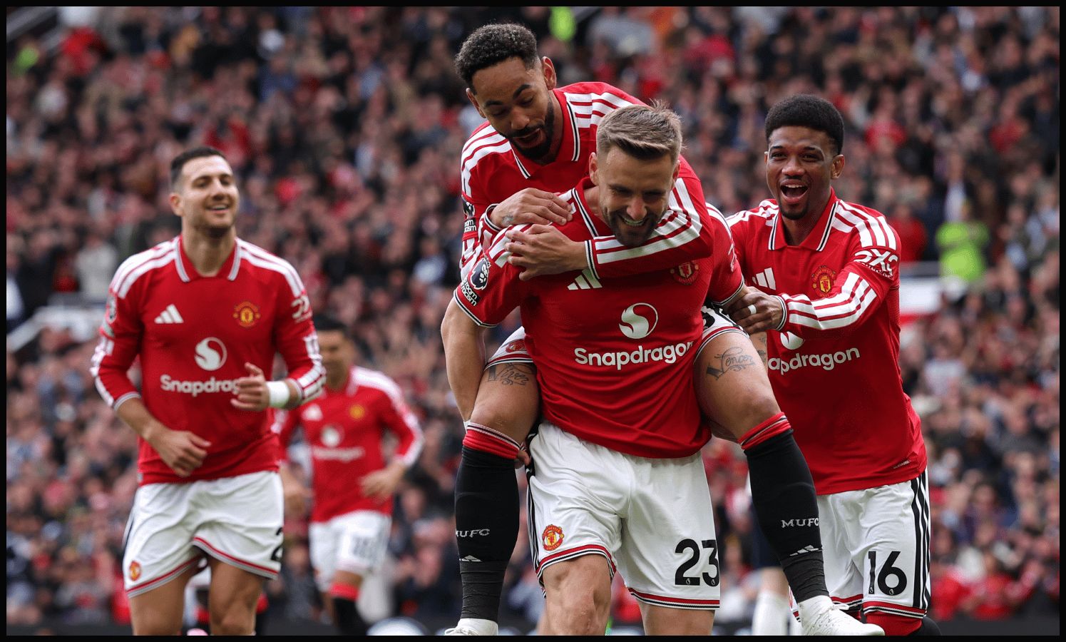 MANCHESTER, ENGLAND - MAY 17: Luke Shaw of Manchester United celebrates scoring his team's first goal with teammates Matheus Cunha and Amad Diallo during the Premier League match between Manchester United and Nottingham Forest at Old Trafford on May 17, 2026 in Manchester, England.