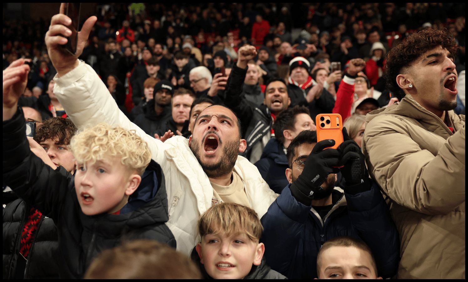 MANCHESTER, ENGLAND - DECEMBER 26: Fans of Manchester United show support for their team prior to the Premier League match between Manchester United and Newcastle United at Old Trafford on December 26, 2025 in Manchester, England.
