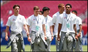 TAMPA, FLORIDA - JUNE 06: Alex Scott, Elliot Anderson and Jarell Quansah #26 of England inspect the pitch prior to the international friendly match between England and New Zealand at Raymond James Stadium on June 06, 2026 in Tampa, Florida.
