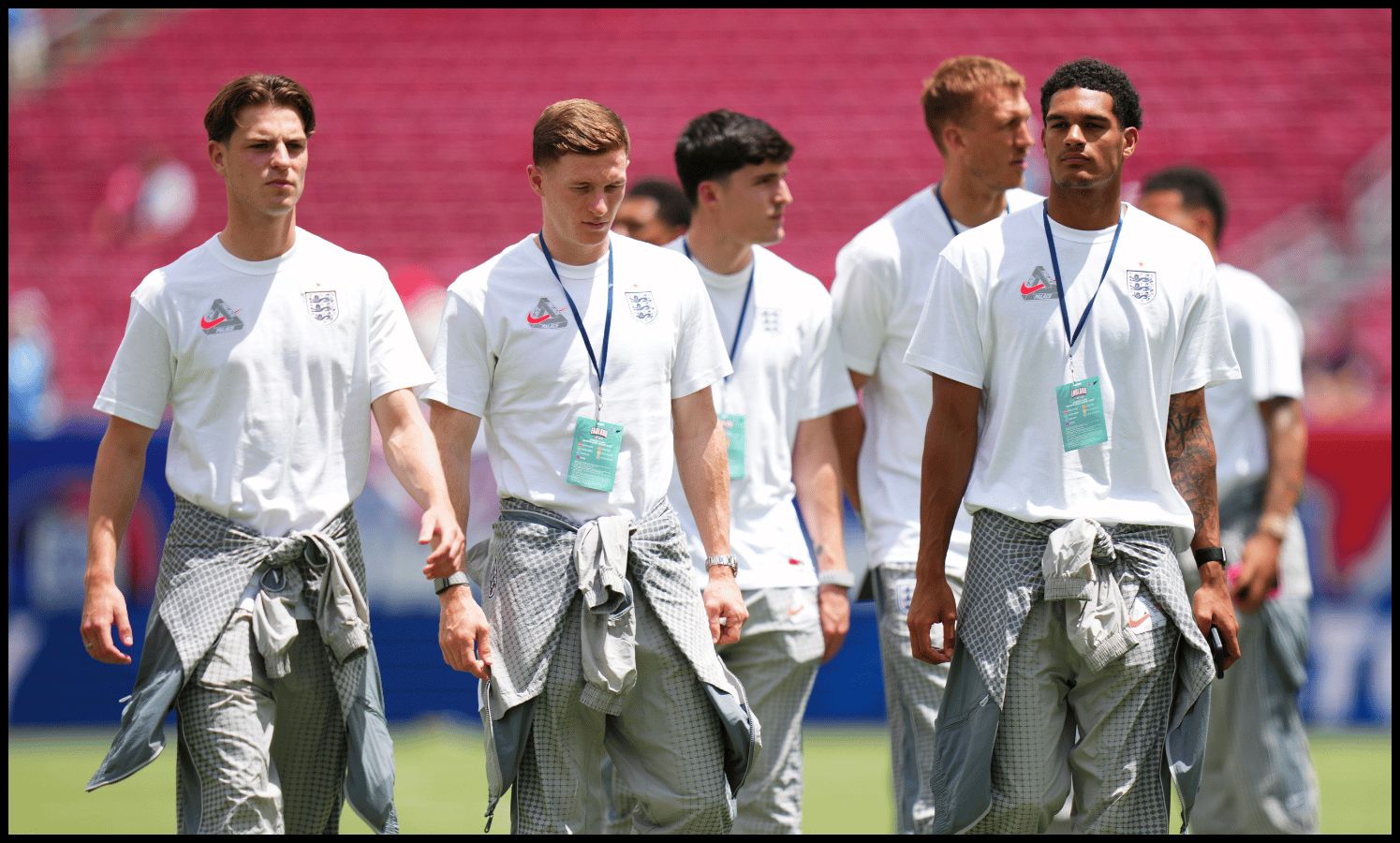 TAMPA, FLORIDA - JUNE 06: Alex Scott, Elliot Anderson and Jarell Quansah #26 of England inspect the pitch prior to the international friendly match between England and New Zealand at Raymond James Stadium on June 06, 2026 in Tampa, Florida.