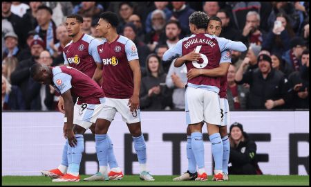 BIRMINGHAM, ENGLAND - MAY 13: Youri Tielemans of Aston Villa celebrates scoring his team's first goal with teammate Douglas Luiz during the Premier League match between Aston Villa and Liverpool FC at Villa Park on May 13, 2024 in Birmingham, England.