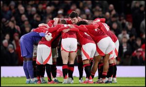 MANCHESTER, ENGLAND - DECEMBER 30: Manchester United players create a huddle prior to the Premier League match between Manchester United FC and Newcastle United FC at Old Trafford on December 30, 2024 in Manchester, England.