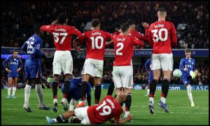 Man Utd's defensive wall jumping while Cole Palmers converts a free-kick for Chelsea