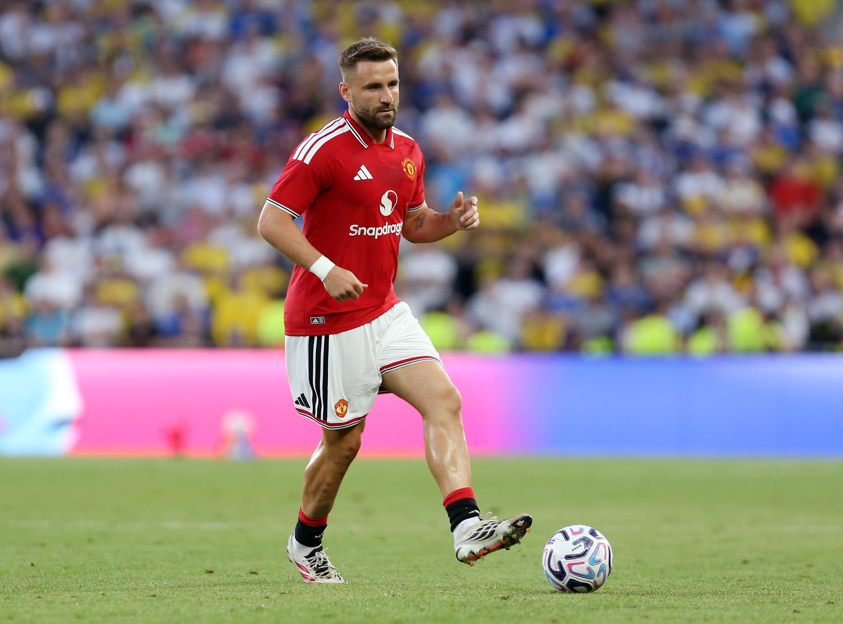 DUBLIN, IRELAND - AUGUST 12: Luke Shaw of Manchester United passes the ball during the pre-season friendly match between Leeds United and Manchester United at Croke Park on August 12, 2026 in Dublin, Ireland.
