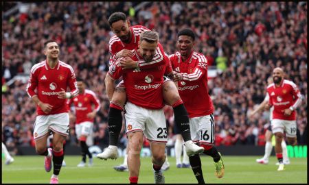 MANCHESTER, ENGLAND - MAY 17: Luke Shaw of Manchester United celebrates scoring his team's first goal with teammates Matheus Cunha and Amad Diallo during the Premier League match between Manchester United and Nottingham Forest at Old Trafford on May 17, 2026 in Manchester, England.
