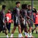 MANCHESTER, ENGLAND - MAY 14: Ethan Wheatley of Manchester United walks to the pitch with teammates during a training session at Carrington Training Ground on May 14, 2025 in Manchester, England