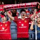SOLNA, SWEDEN - AUGUST 1: Young Manchester United supporters with scarves during the pre-season friendly match between Manchester United and Atletico de Madrid at Strawberry Arena on August 1, 2026 in Solna, Sweden