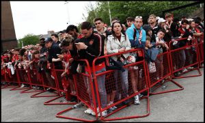 MANCHESTER, ENGLAND - APRIL 27: Fans wait for players to arrive during the Premier League match between Manchester United and Brentford at Old Trafford on April 27, 2026 in Manchester, England.