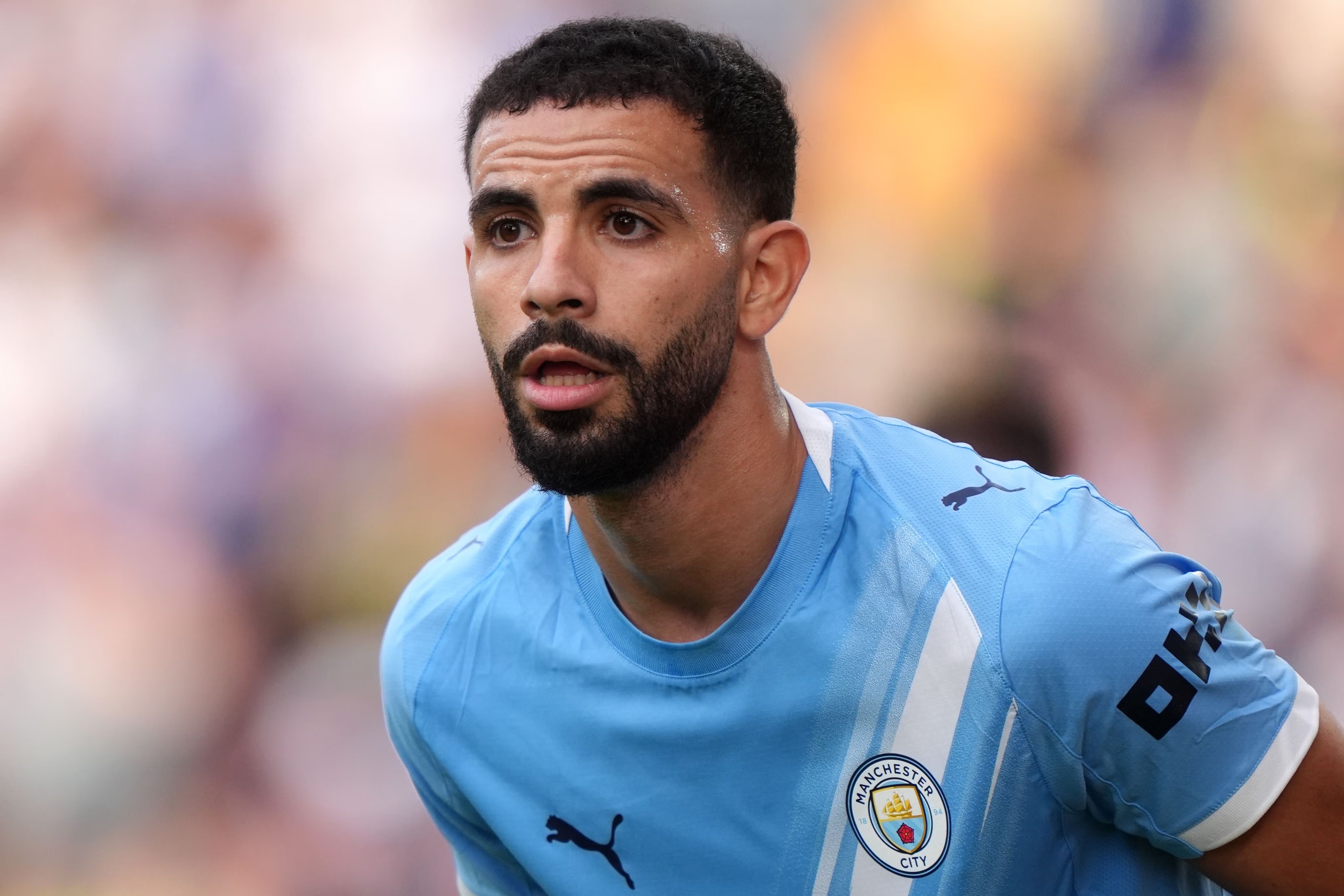 Rayan Ait-Nouri in action for Man City