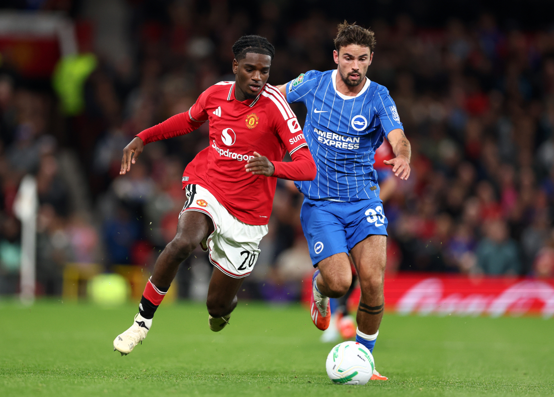 MANCHESTER, ENGLAND - SEPTEMBER 16: Ayden Heaven of Manchester United runs with the ball under pressure from Matt O'Riley of Brighton & Hove Albion during the Carabao Cup Third Round match between Manchester United and Brighton & Hove Albion at Old Trafford on September 16, 2026 in Manchester, England