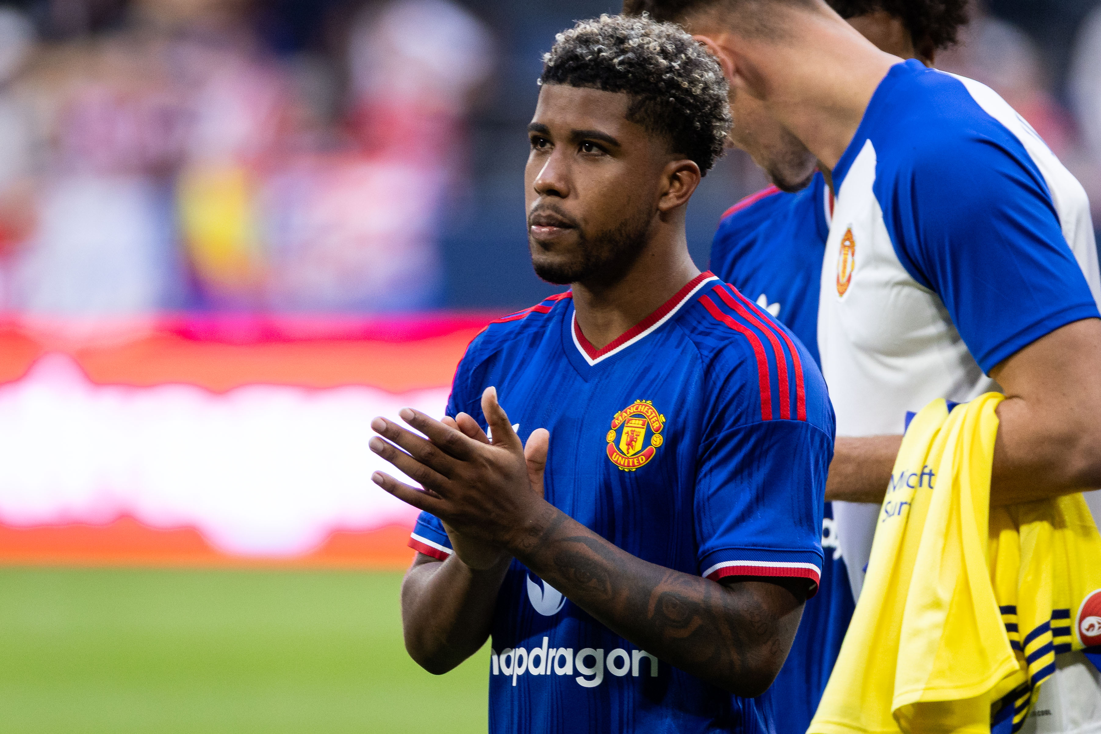 SOLNA, SWEDEN - AUGUST 1: Andrey Santos of Manchester United thanks supporters after the pre-season friendly match between Manchester United and Atletico de Madrid at Strawberry Arena on August 1, 2026 in Solna, Sweden. (Photo by Michael Campanella/Getty Images)