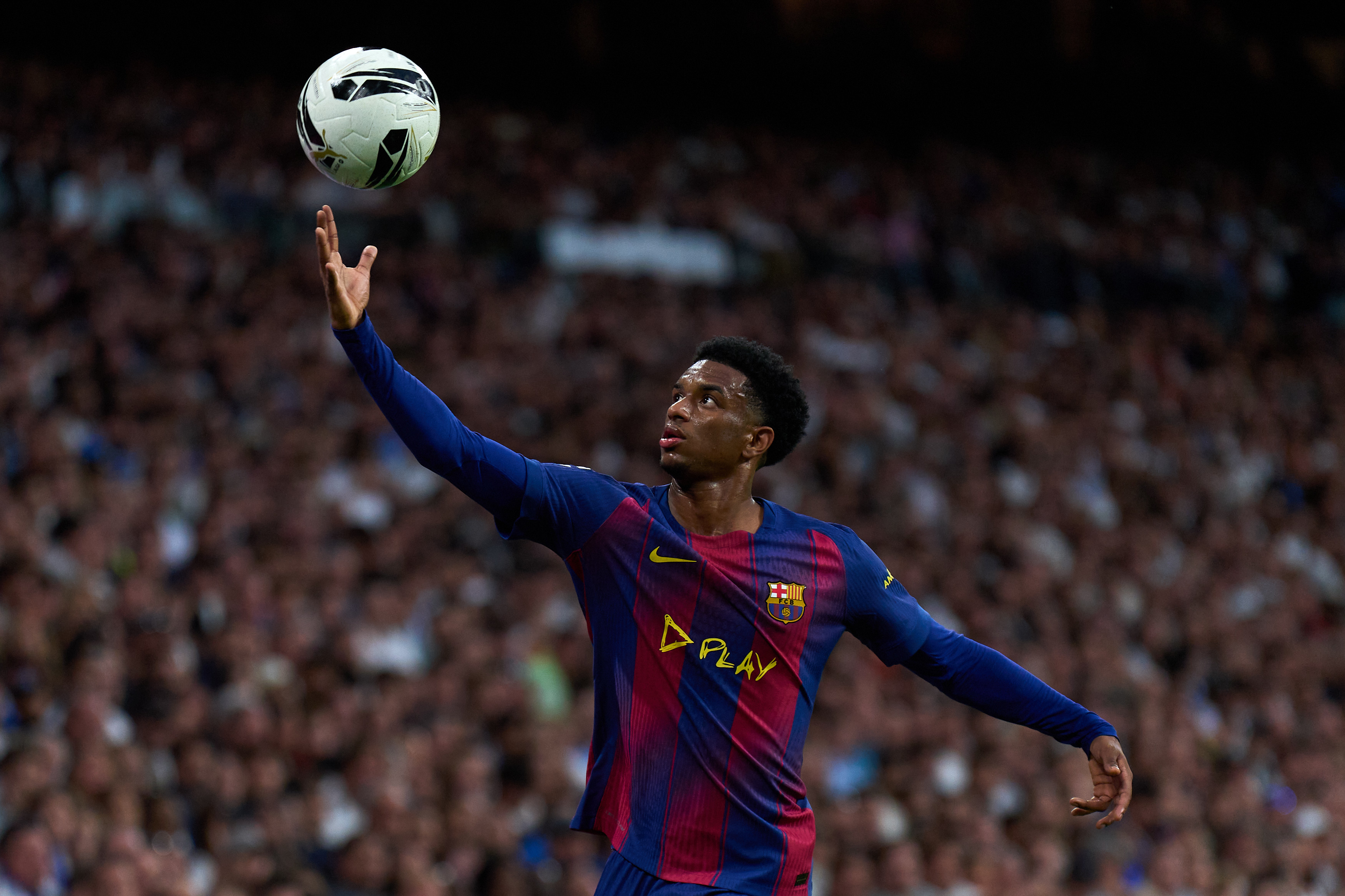MADRID, SPAIN - OCTOBER 26: Alejandro Balde of FC Barcelona controls the ball during the LaLiga EA Sports match between Real Madrid CF and FC Barcelona at Estadio Santiago Bernabeu on October 26, 2025 in Madrid, Spain. (Photo by Angel Martinez/Getty Images)