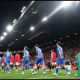 MANCHESTER, ENGLAND - SEPTEMBER 16: Manchester United and Brighton & Hove Albion players walk out before the Carabao Cup Third Round match between Manchester United and Brighton & Hove Albion at Old Trafford on September 16, 2026 in Manchester, England