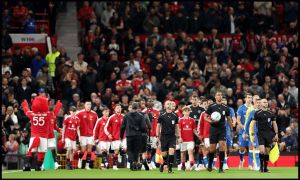 MANCHESTER, ENGLAND - SEPTEMBER 16: Manchester United and Brighton & Hove Albion players walk out before the Carabao Cup Third Round match between Manchester United and Brighton & Hove Albion at Old Trafford on September 16, 2026 in Manchester, England.