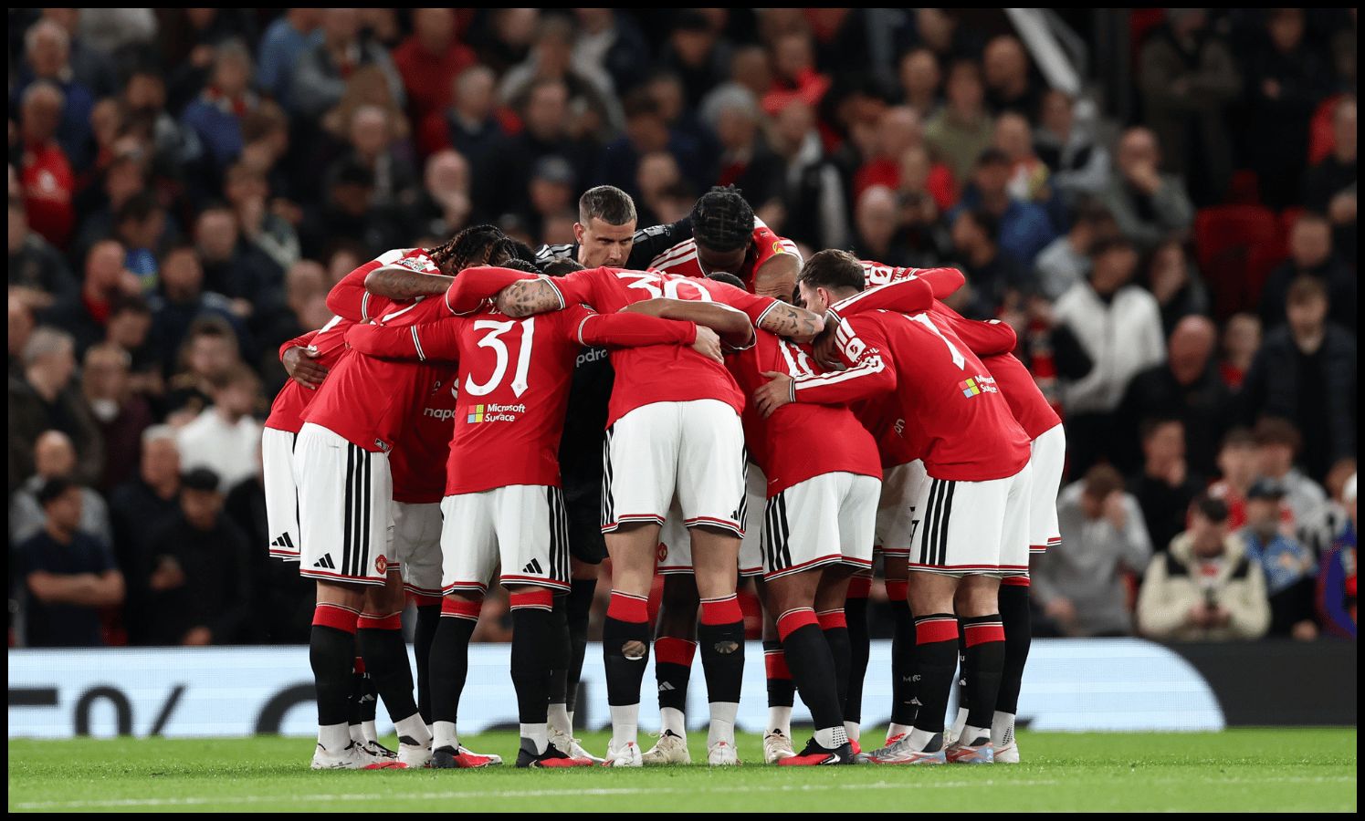 MANCHESTER, ENGLAND - SEPTEMBER 16: Manchester United players huddle before the Carabao Cup Third Round match between Manchester United and Brighton & Hove Albion at Old Trafford on September 16, 2026 in Manchester, England.
