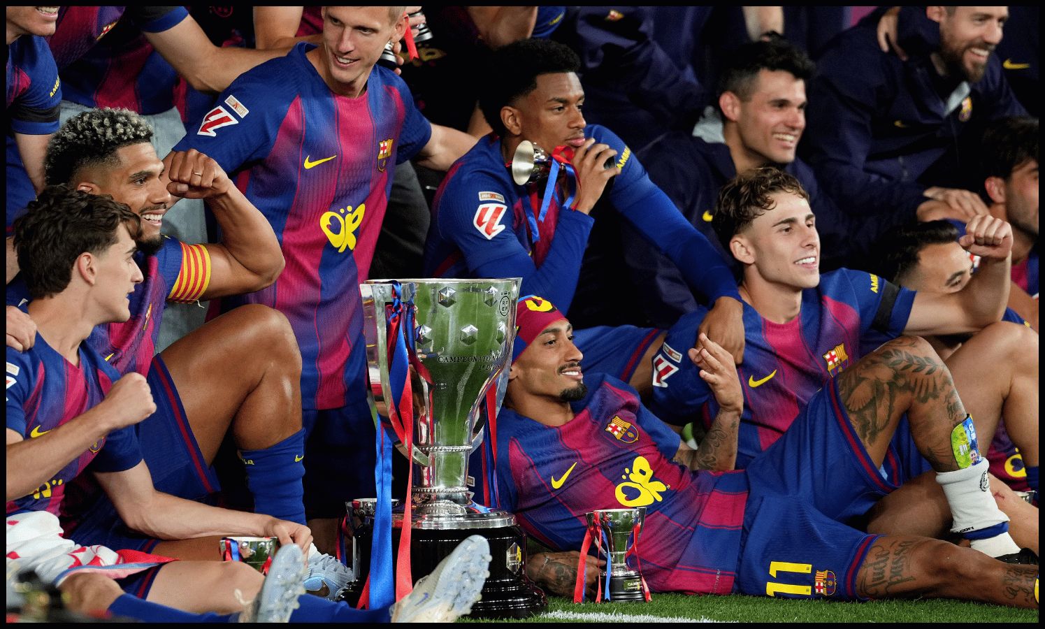 BARCELONA, SPAIN - MAY 10: Robert Lewandowski, Gavi, Ronald Araujo, Dani Olmo, Alejandro Balde and Raphinha of FC Barcelona celebrate as they pose for a photograph with the LaLiga EA Sports trophy, after defeating Real Madrid to secure the title, during the LaLiga EA Sports match between FC Barcelona and Real Madrid CF at Spotify Camp Nou on May 10, 2026 in Barcelona, Spain.