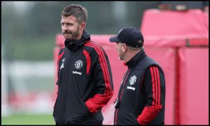 MANCHESTER, ENGLAND - OCTOBER 12: Michael Carrick, Manager of Manchester United, talks with Steve Holland, Assistant Coach of Manchester United during the training session ahead of the UEFA Champions League 2026/27 League Phase MD2 at Carrington Training Ground on October 12, 2026 in Manchester, England.