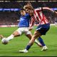 MADRID, SPAIN - OCTOBER 13: Pablo Barrios of Atletico Madrid crosses the ball under pressure from Lisandro Martinez of Manchester United during the UEFA Champions League 2026/27 League Phase MD2 match between Atletico de Madrid and Manchester United at Estadio Metropolitano on October 13, 2026 in Madrid, Spain